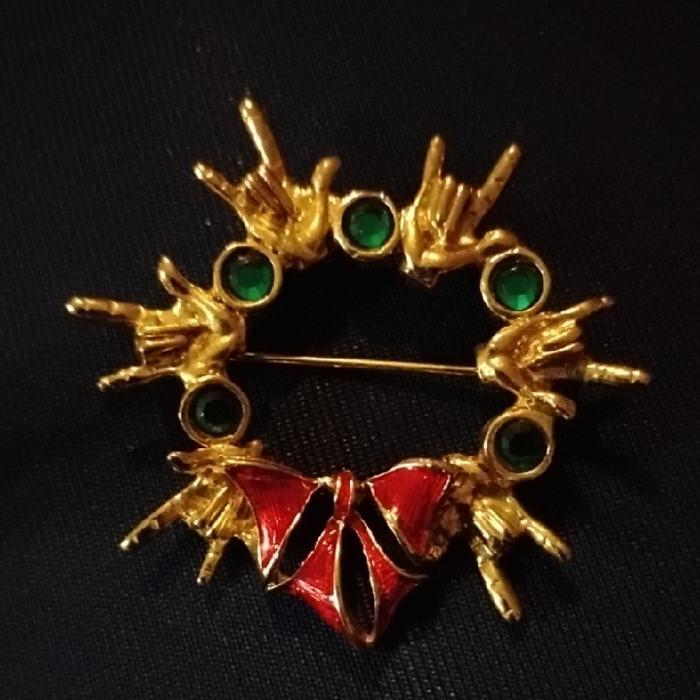 Chic Gold Brooch with Red and Green Details